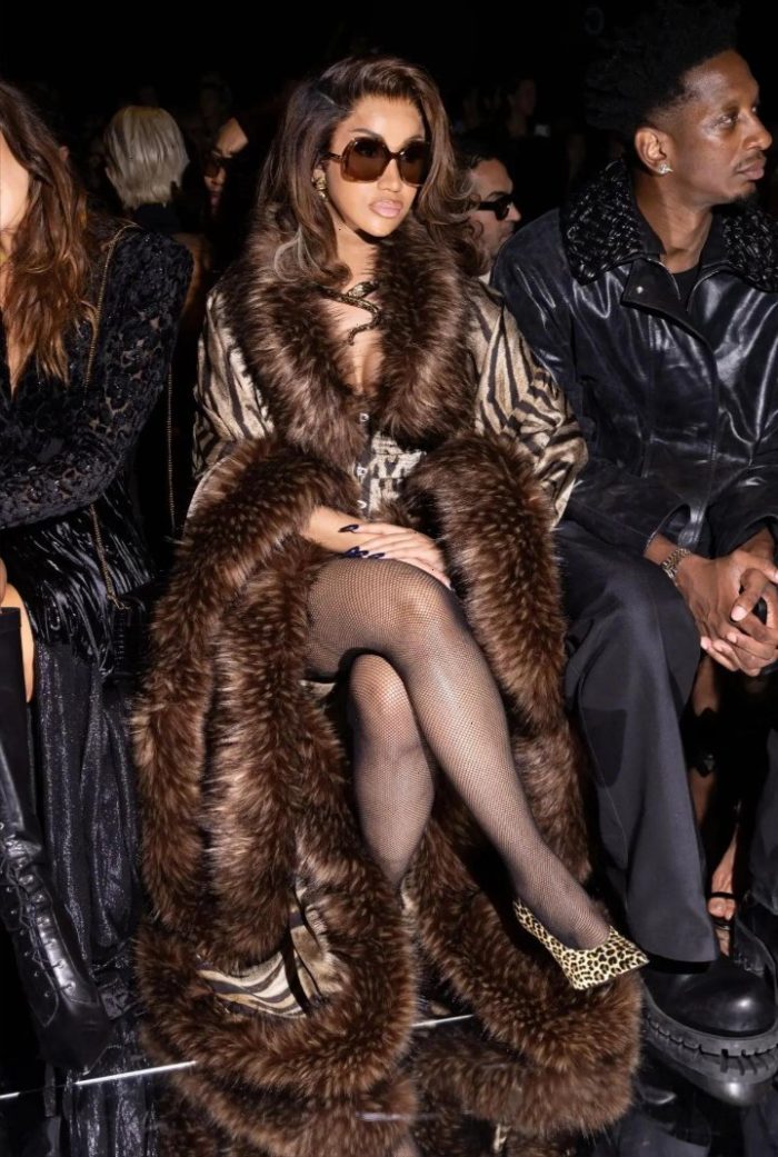 Cardi B in black fishnet tights