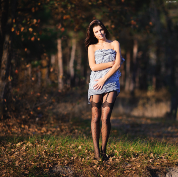 Woman wears suspender pantyhose