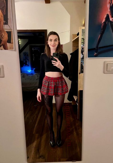 I really like this mix of black nylons and classic red schoolgirl skirt and my tired after all day at university smile